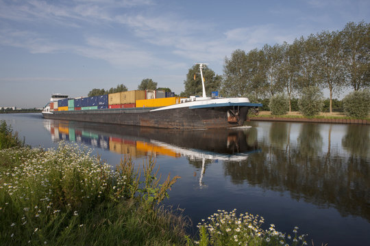 Riverbaot, barge Netherlands. Inland river transport. Inland shipping. Containership. Meppelerdiep near Zwartsluis