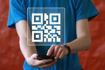 Businessman pressing button qr code on smartphone icon