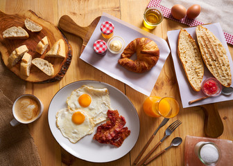 Continental breakfast croissant eggs bacon bread