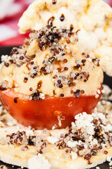 Vegetarian food tomato with hummus and seeds