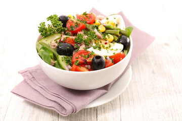 tuna salad with tomato,olive and egg
