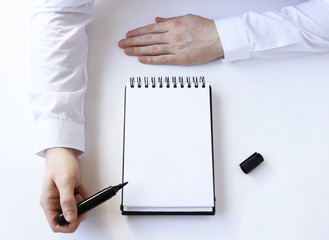 buisness process. Hand points to a notepad