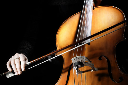Cello player Cellist hands playing cello with bow