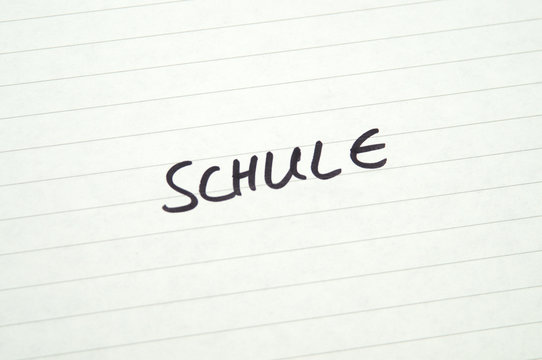 Word Schule (School) in Handwriting on lined paper
