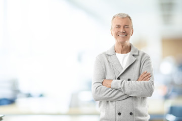 Senior sales man in the office. Shot of a casual marketing manager businessman standing in the office.