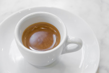 coffee cup on white marble table