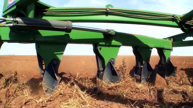 Tractor with implement in a field