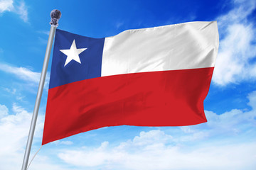 Flag of Chile developing against a clear blue sky