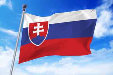 Flag of Slovakia developing against a clear blue sky