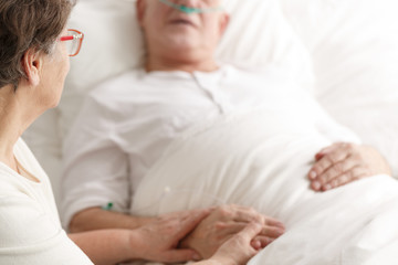 Wife caring about dying spouse