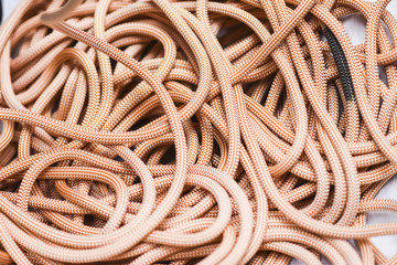 New climbing rope lying on a white background.