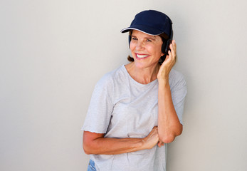 happy older woman smiling with headphones