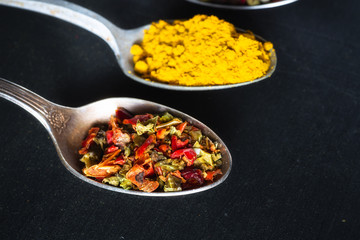 spoons with salt and seasonings closeup