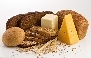 Various bread and cheese over a white background.