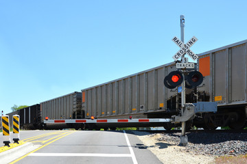 Freight train at crossing gate