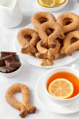 Biscuits with sugar in a bowl on a white background.