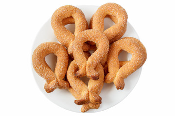 Biscuits with sugar in a bowl on a white background.