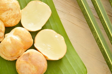toddy palm tropical fruit on banana leaf