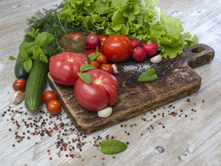 Fresh vegetables on a wooden background. 