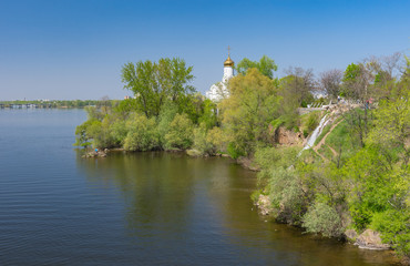 Spring landscape with an Orthodox church on a Monastyrsky island on Dnipro river, Dnipro city, Ukraine.