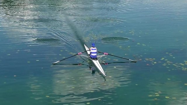 Single scull rowing competitor paddles, full hd, slow motion video
