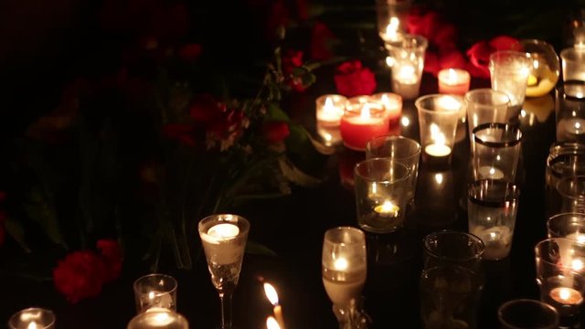 Memorial in honor of the victims of the victims of terrorism. People bring many flowers and candles to the place of death. People mourn. Policy, consequences of terrorism and military operations.