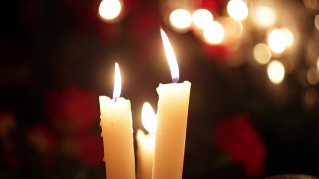 The place of death of people from the terrorist attack. Flowers and candles in memory of victims of a terrorist attack. Grief, compassion and tears of people. Consequences of military operations and