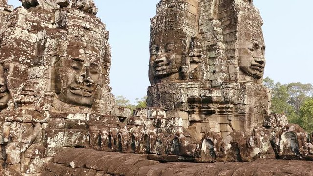 Tilt up of ancient Bayon temple in Angkor Wat at Siem Reap, Cambodia.