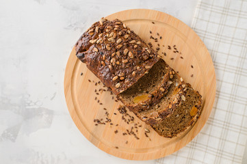 cut grain fitness bread on cutting wooden board