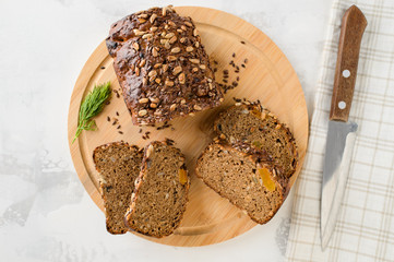cut grain fitness bread on cutting wooden board