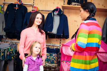Obraz premium Mother And Daughter At Children's Store
