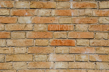 brick old wall with autographs