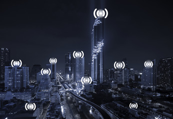 Blue Tone City Scape and Wifi Network Connection Concept