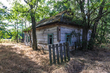 Fototapeta na wymiar House in desolate Mashevo village in Chernobyl Exclusion Zone, Ukraine
