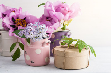 Kraft gift box, peonies and lilac flowers