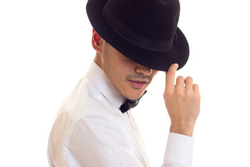 Young man in white T-shirt with black hat