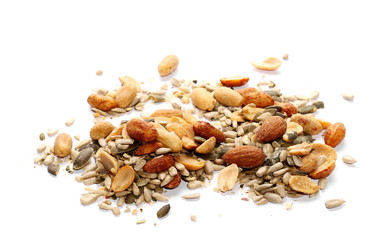 Healthy mix of salty and spicy peanuts, almonds, sunflowers, and pumpkin seeds, isolated on white background