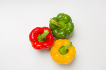 Three peppers on white background