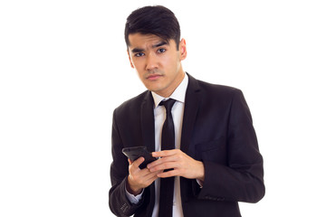 Young man in suit talking on the phone
