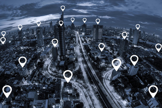 Map pin flat on blue tone Aerial view of cityscape Bangkok business district at twilight  background.