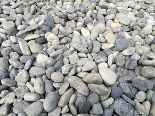 Pebble stone background, outdoor natural river white grey rock pebble small size, abstract dry garden round stones texture background, Material for construction, numerous pile pebble medium shot