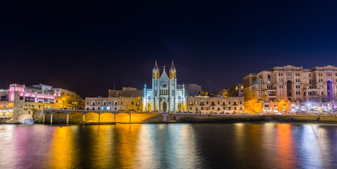 Fototapeta na wymiar Balluta bay, Malta - The beautiful Church of Our Lady of Mount Carmel at Balluta bay by night