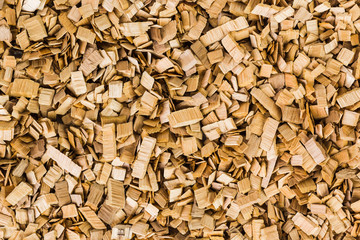 Background image of brown wood chips. Texture.