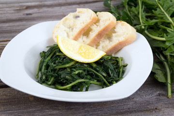 prepared boiled dandelion leaf green
