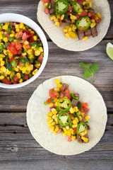 beef corn soft taco on rustic wood table