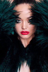 gorgeous woman with dark hair in luxurious fur coat