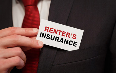 Businessman putting a card with text Renter's insurance in the pocket