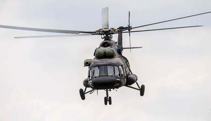 Fototapeta na wymiar Army transport helicopter in low level flight