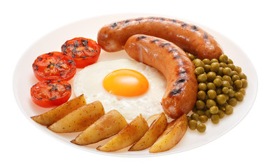 Grilled sausages with potatoes, peas, tomatoes and egg on the plate. Isolated on white background.