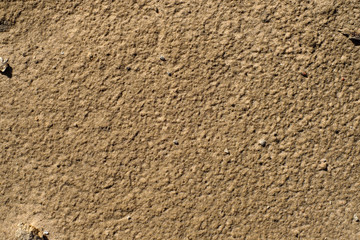 Yellow wall of the building with a bumpy surface